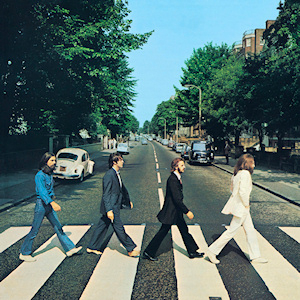 Beatles Album Cover. 4 Beatles singers walking across the street on Abby Road.